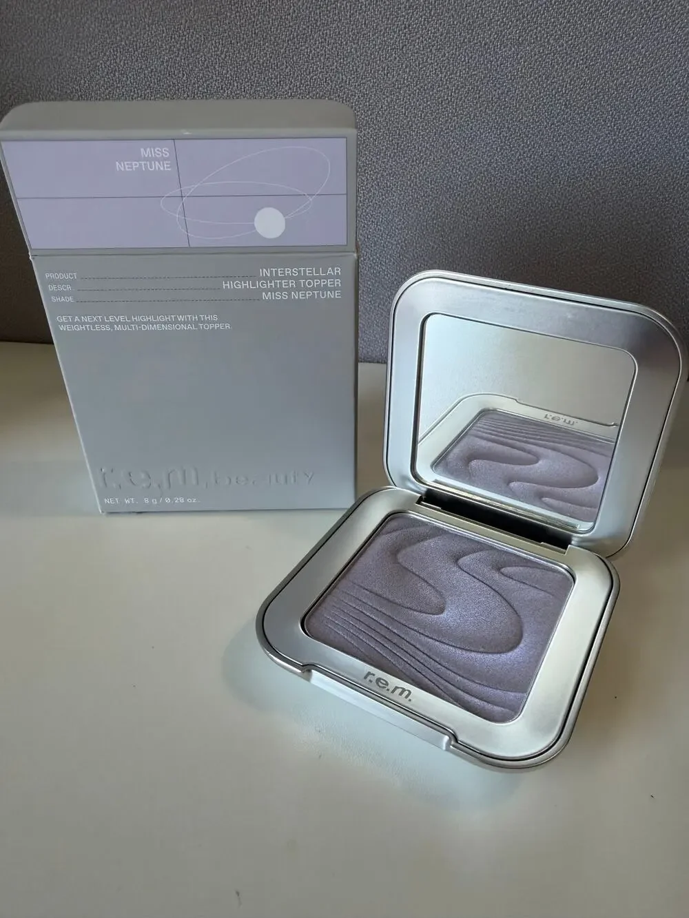 r.e.m. beauty highlighter in miss neptune